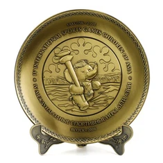 Starinski metalni suvenir s logotipom